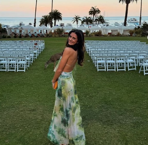Backless green tie-dye maxi dress at a seaside wedding